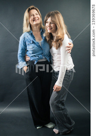 Happy mother and daughter embracing, enjoying family bond Happy mother and daughter embracing, enjoying family bond 139369678