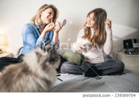 Mother and daughter bonding during beauty routine at home Mother and daughter bonding during beauty routine at home 139369704