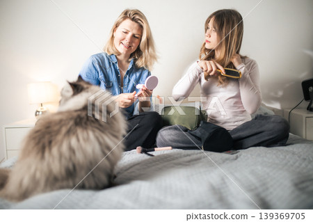 Young women doing morning beauty routine with cat 139369705