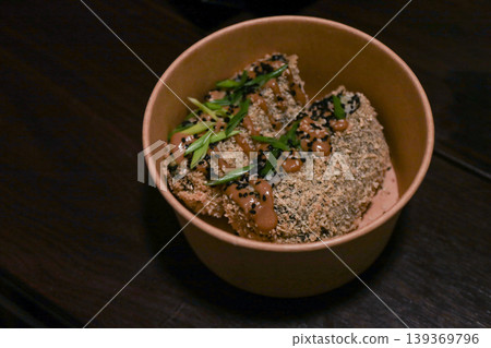 Crunchy Asian fusion appetizer with sesame seeds and scallions in a rustic bowl Crunchy Asian fusion appetizer with sesame seeds and scallions in a rustic bowl 139369796