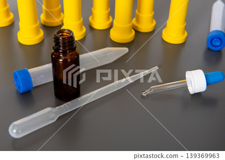 Laboratory pipettes dropper and sample vial with testing equipment Laboratory pipettes dropper and sample vial with testing equipment 139369963