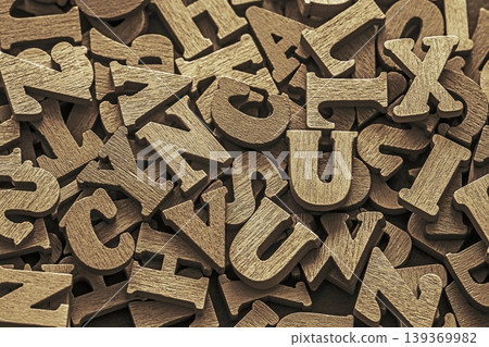 Pile of old vintage wooden letters. Typography background composition. Pile of old vintage wooden letters. Typography background composition. 139369982