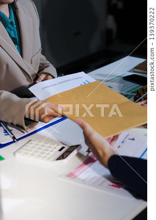 Business woman accountant working in office checking financial accounts and allocating company budgets. Business woman accountant working in office checking financial accounts and allocating company budgets. 139370222