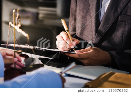 Consultation and conference of professional businesswoman and Male lawyers working and discussion having at law firm in office. Concepts of law, Judge gavel with scales of justice Consultation and conference of professional businesswoman and Male lawyers working and discussion having at law firm in office. Concepts of law, Judge gavel with scales of justice 139370262