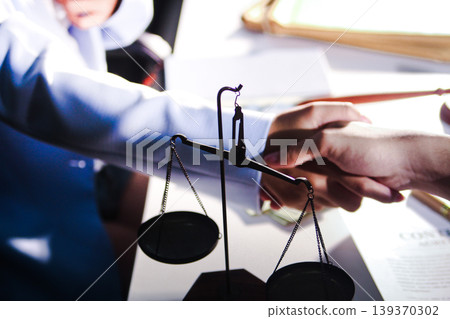 Consultation and conference of professional businesswoman and Male lawyers working and discussion having at law firm in office. Concepts of law, Judge gavel with scales of justice Consultation and conference of professional businesswoman and Male lawyers working and discussion having at law firm in office. Concepts of law, Judge gavel with scales of justice 139370302