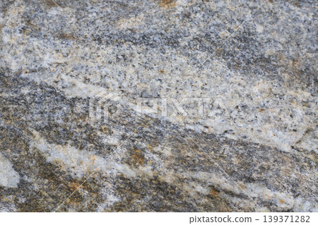 Close-up of natural grey granite stone texture 139371282
