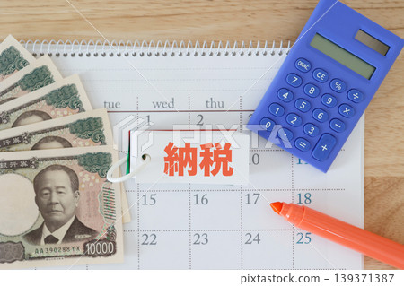 Tax deadlines and payments. Calendar and Japanese yen banknotes. Calculator and marker. Red text. Tax deadlines and payments. Calendar and Japanese yen banknotes. Calculator and marker. Red text. 139371387