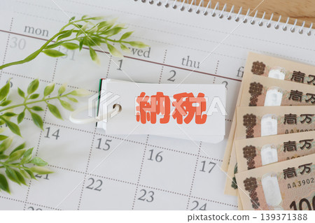 Paying taxes. Check payment deadlines with money and a calendar. (Image of a red logo) Paying taxes. Check payment deadlines with money and a calendar. (Image of a red logo) 139371388