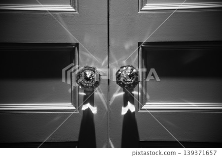 Image of a black and white door, wedding hall, banquet hall, restaurant, or entrance illuminated by lighting. Image of a black and white door, wedding hall, banquet hall, restaurant, or entrance illuminated by lighting. 139371657
