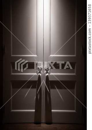 Image of a black and white door, wedding hall, banquet hall, restaurant, or entrance illuminated by lighting. Image of a black and white door, wedding hall, banquet hall, restaurant, or entrance illuminated by lighting. 139371658