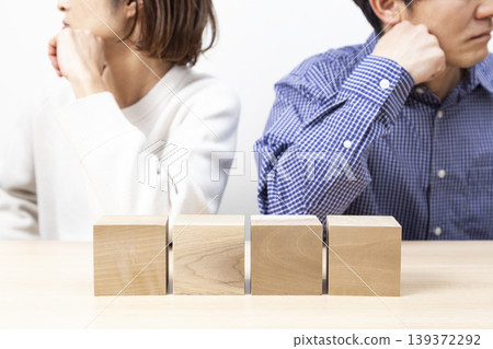 A couple arguing over plain blocks A couple arguing over plain blocks 139372292