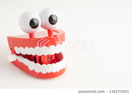 Funny red teeth with eye toy denture model for dental health care. Funny red teeth with eye toy denture model for dental health care. 139373003