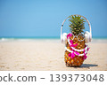 Summer in the party.  Hipster Pineapple Fashion in sunglass and listen music with sunblock and sandal 139373048