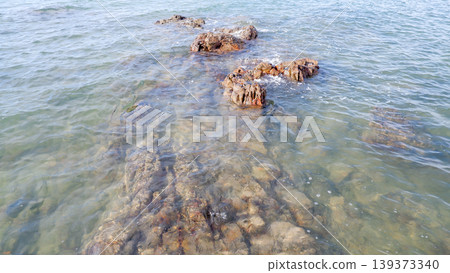 Close Up of Submerged Coastal Rocks in Clear Water 139373340