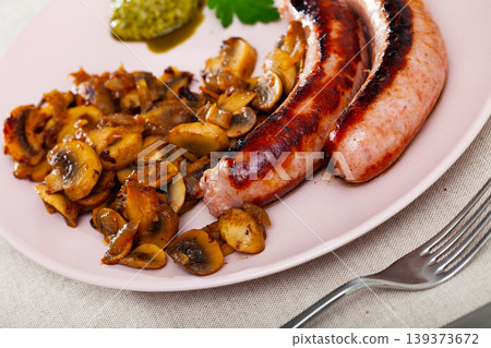 Roasted sausages with mushrooms Roasted sausages with mushrooms 139373672