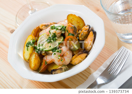 Stewed potatoes with shrimps, mussels 139373734