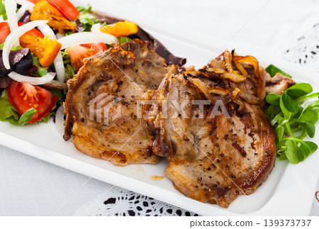 Grilled pork chop with salad Grilled pork chop with salad 139373737