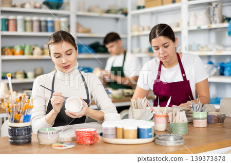 Two young women making pottery in workshop Two young women making pottery in workshop 139373878