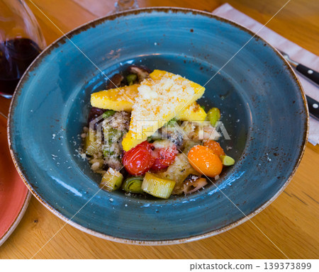 Mushrooms with baked vegetables under cheese Mushrooms with baked vegetables under cheese 139373899