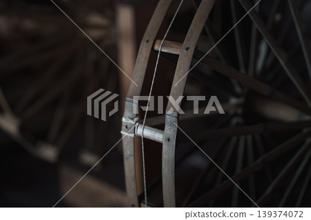 A spinning wheel located in the Hara House at Kawasaki Folk House Garden. A spinning wheel located in the Hara House at Kawasaki Folk House Garden. 139374072
