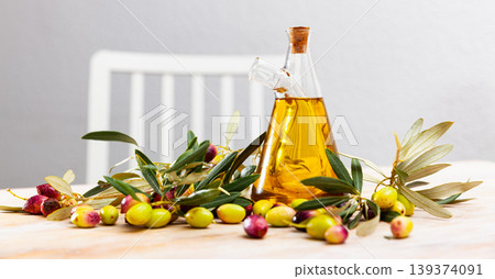 Olive oil in mug on wooden table 139374091