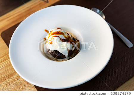 Chocolate brownie with soft ice cream Chocolate brownie with soft ice cream 139374179