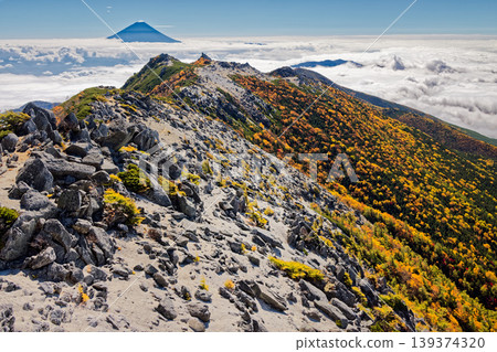 Mount Yakushi and Mount Fuji above the clouds, as seen from Mount Kannon in the Southern Alps, Houou Sanzan. 139374320