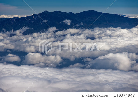 The Okuchichibu mountain range above the clouds, as seen from the ridge of the Southern Alps, the Houou Sanzan, and Kannon-dake peaks. The Okuchichibu mountain range above the clouds, as seen from the ridge of the Southern Alps, the Houou Sanzan, and Kannon-dake peaks. 139374948