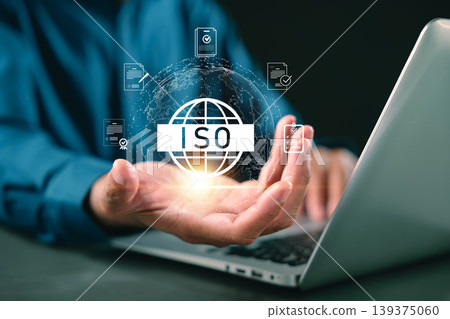 ISO certification quality control process shows business professional holding digital globe icons representing international iso standardization and global business assurance and verified certificate ISO certification quality control process shows business professional holding digital globe icons representing international iso standardization and global business assurance and verified certificate 139375060