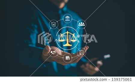 Lawyer provides legal justice, law services, legislation advice, displaying glowing digital scales icons with courtroom symbols representing client protection or rights assistance digitally 139375061