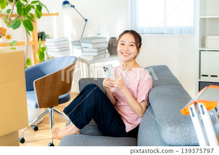 Young woman preparing to move 139375797