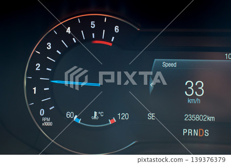 Close-up of a car dashboard showing speed and tachometer Close-up of a car dashboard showing speed and tachometer 139376379