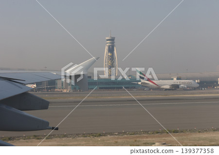 Dubai Airport, completed tower, viewed from an A380 taxiing. Dubai Airport, completed tower, viewed from an A380 taxiing. 139377358