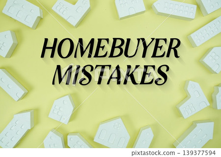 Homebuyer Mistakes text with house models on yellow background Homebuyer Mistakes text with house models on yellow background 139377594
