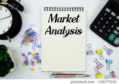 Market Analysis text written on notepad with calculator and alarm clock Market Analysis text written on notepad with calculator and alarm clock 139377636