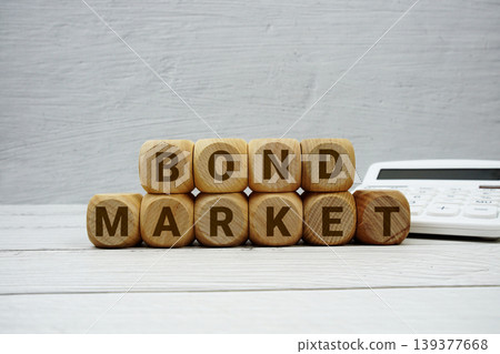 Bond Market alphabet letters with calculator on wooden background Bond Market alphabet letters with calculator on wooden background 139377668