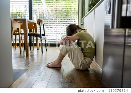 Distressed child facing aggressive parenting and emotional fear at home. 139379214