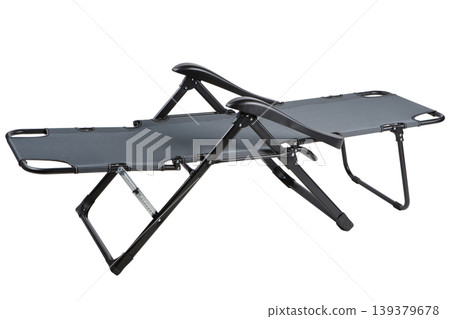 Folding garden lounge chair, reclining camping bed for outdoor relaxation isolated on white. Folding garden lounge chair, reclining camping bed for outdoor relaxation isolated on white. 139379678