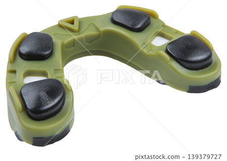 Close up of a professional olive and black double layered mouthguard for maximum dental protection. 139379727