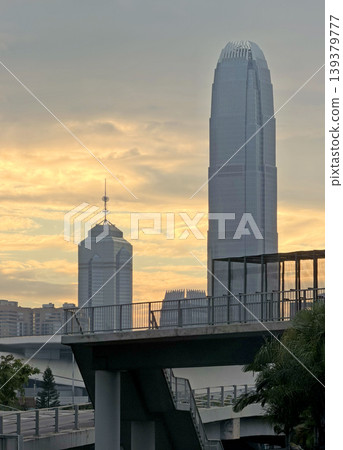 Iconic Hong Kong skyscrapers bathed in the warm glow of a sunset sky 139379777