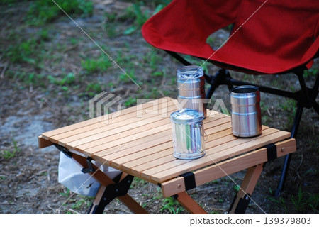 Wooden table and chairs placed at the campsite 139379803