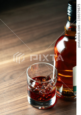 Whiskey bottle glass ice premium alcohol 139379875