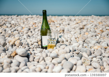Bottle and glass of cider on Etretat beach Bottle and glass of cider on Etretat beach 139380897