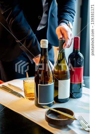 Modern dining establishment showcasing attentive service and thoughtfully selected wine pairings Modern dining establishment showcasing attentive service and thoughtfully selected wine pairings 139381171