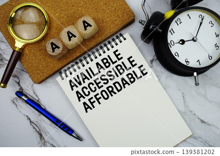 AAA Available, Accessible, Affordable text written on notepad with magnifying glass and alarm clock on marble background AAA Available, Accessible, Affordable text written on notepad with magnifying glass and alarm clock on marble background 139381202