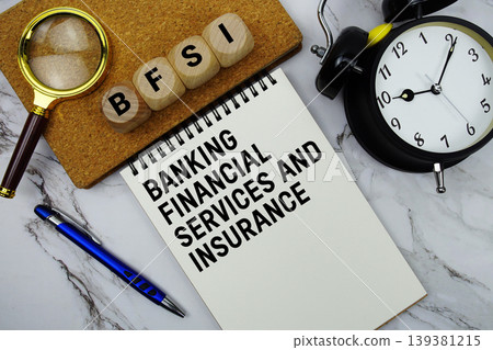BFSI Banking Financial Services and Insurance text written on notepad with magnifying glass and alarm clock on marble background BFSI Banking Financial Services and Insurance text written on notepad with magnifying glass and alarm clock on marble background 139381215