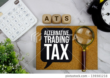 ATS Alternative Trading Tax text with calculator, magnifying glass and alarm clock on marble background 139381218