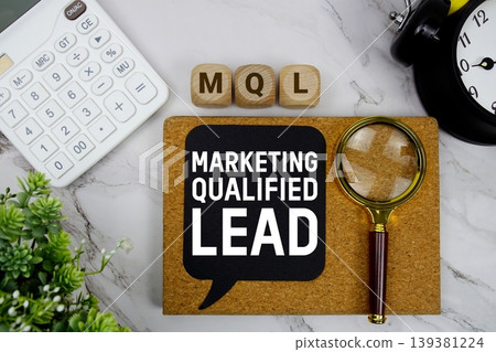 MQL Marketing Qualified Lead text with calculator, magnifying glass and alarm clock on marble background MQL Marketing Qualified Lead text with calculator, magnifying glass and alarm clock on marble background 139381224