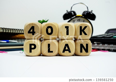 401K Plan alphabet letters with calculator and alarm clock on white background 139381250