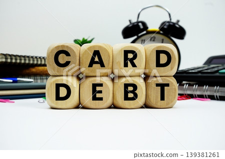 Card Debt alphabet letters with calculator and alarm clock on white background Card Debt alphabet letters with calculator and alarm clock on white background 139381261